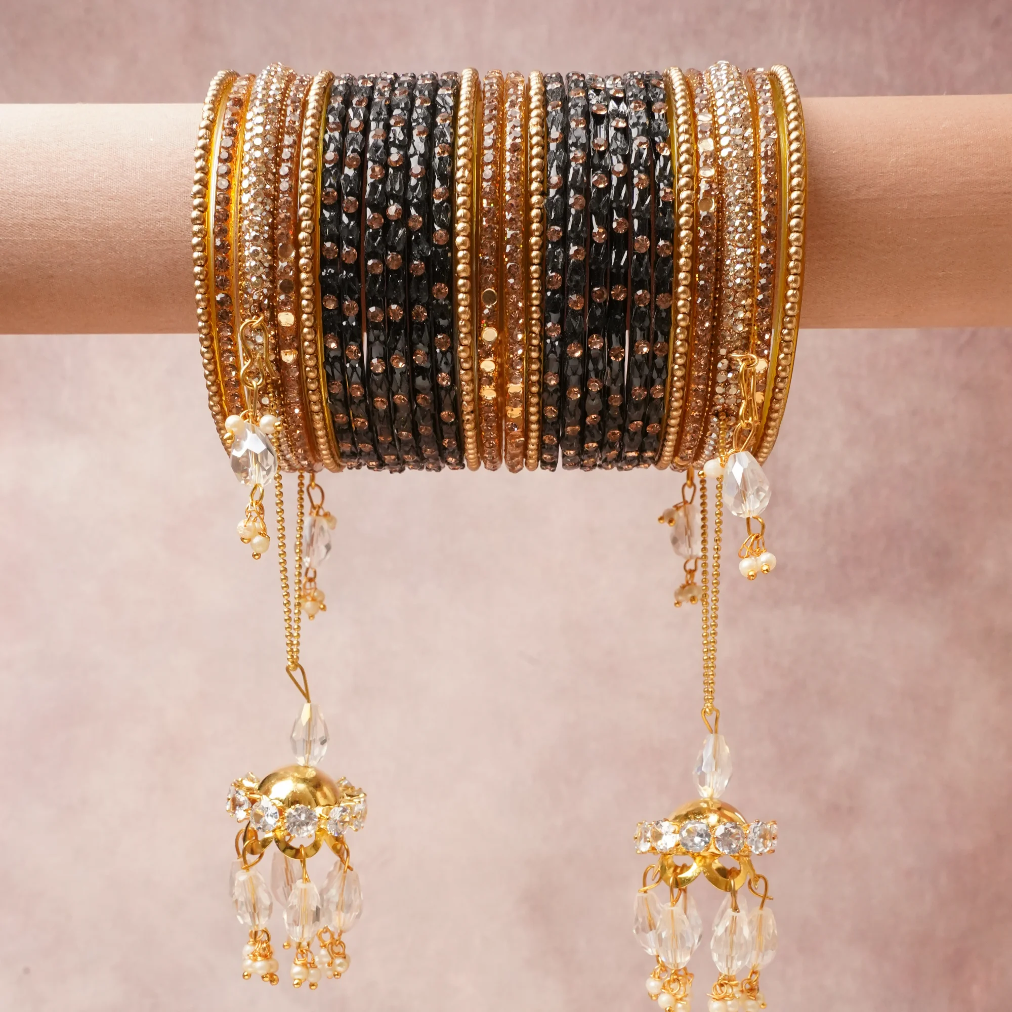 A commanding Black anchors this beautiful set, enriched with accents of Clear Crystal, Pearl White that add depth and dimension.

Featuring a striking composition of Glass, Gold-toned Metal, Crystals, Simulated Pearls, this set carries intricate craftsmanship and strong presence. Grand in form, it is created for moments that deserve to be marked.